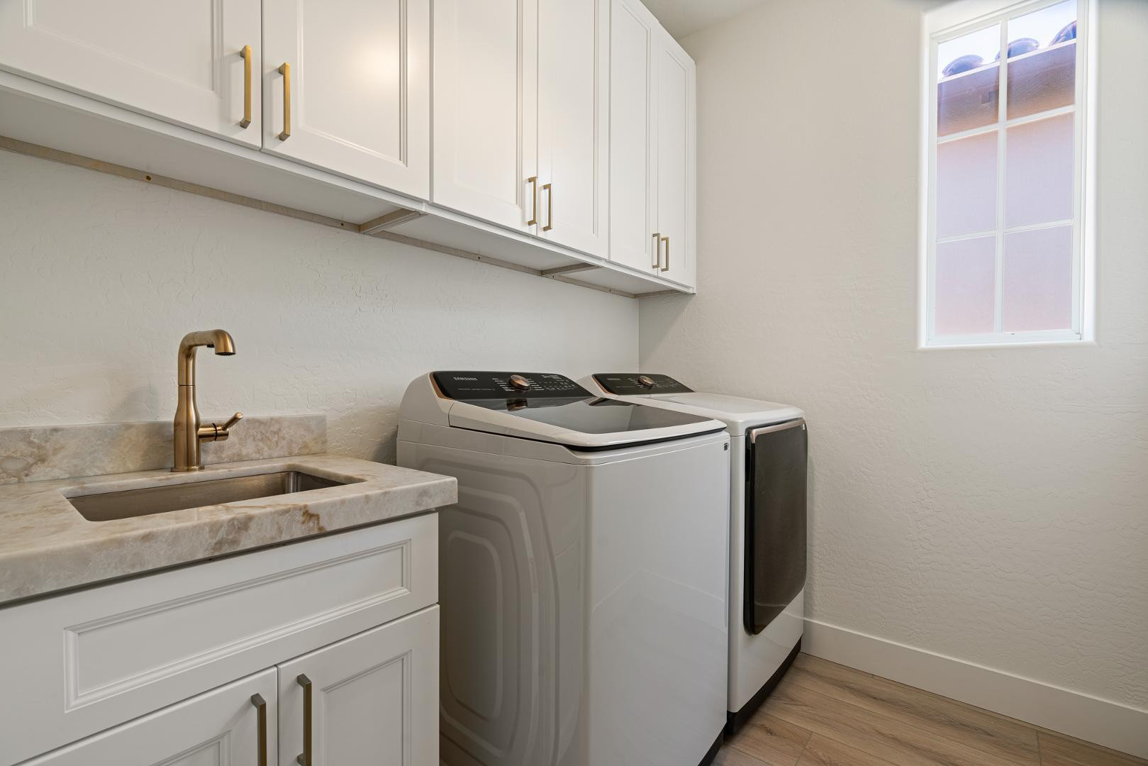 8905 East Mountain Spring Road, Unit 37 Scottsdale, AZ 85255 - Photo 24 of 31 a kitchen with granite countertop white cabinets and a sink