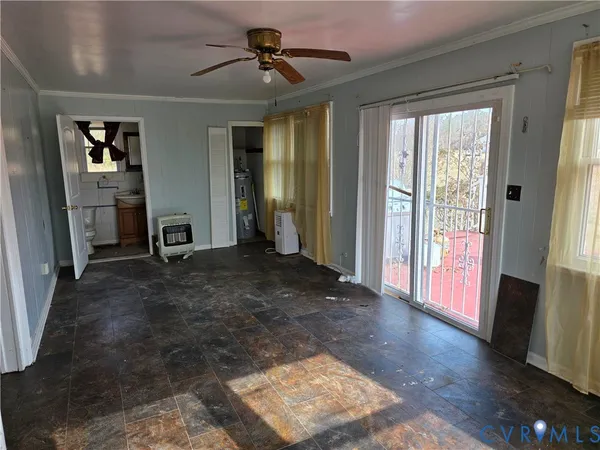a view of a livingroom with furniture window and wooden floor