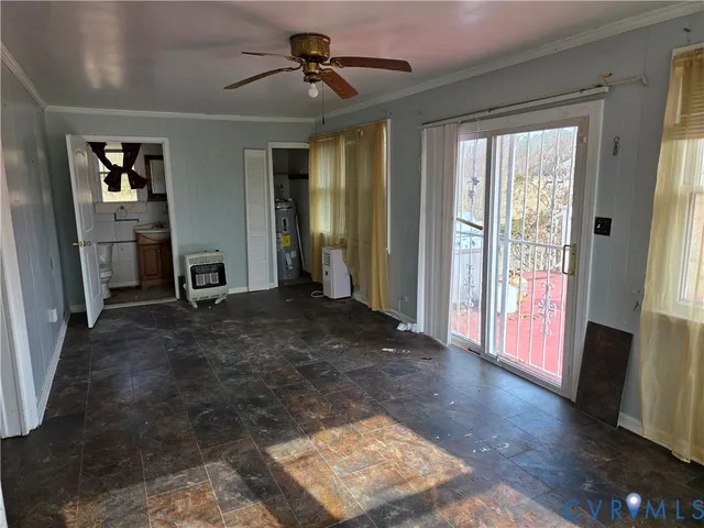 a view of a livingroom with furniture window and wooden floor