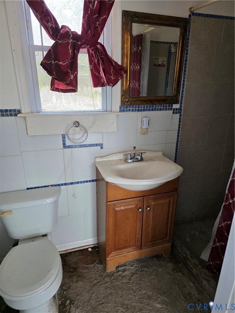 24806 Sawmill Road Carson, VA 23830 - Photo 13 of 19 a bathroom with a sink and a mirror