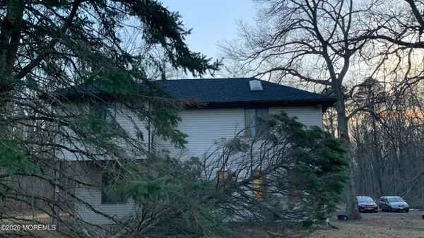 a view of a house with a tree