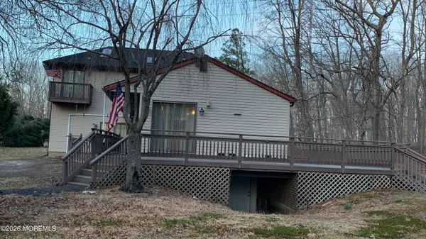 a front view of a house with a bench