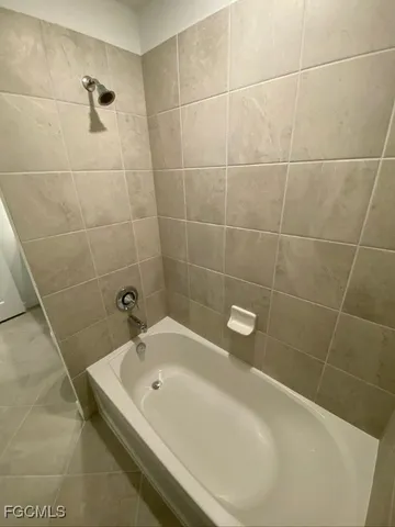 a bathroom with a white bathtub