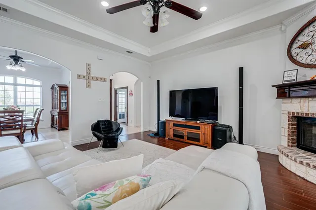 a bedroom with furniture and a flat screen tv