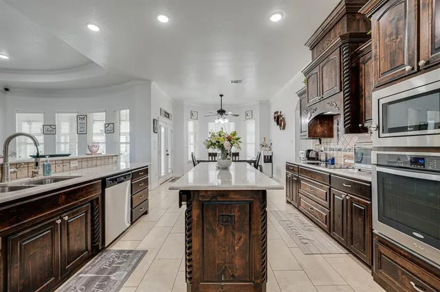 a view of a a dining room with furniture window and wooden floor