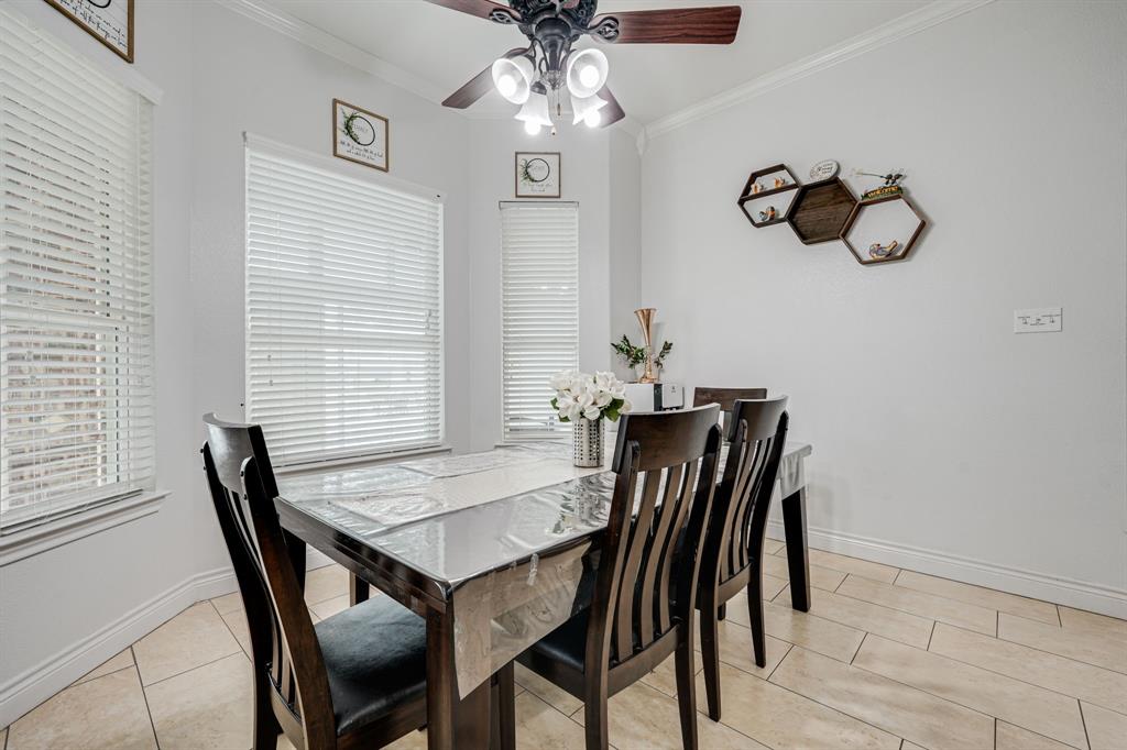 1192 Seaborn Road Ponder, TX 76259 - Photo 18 of 40 a view of a dining room with furniture and wooden floor