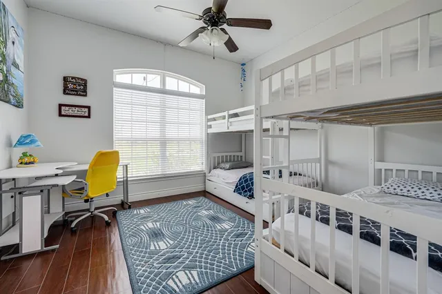 a bathroom with a granite countertop sink mirror and a bath tub