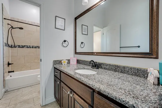 a bedroom with bed and a window