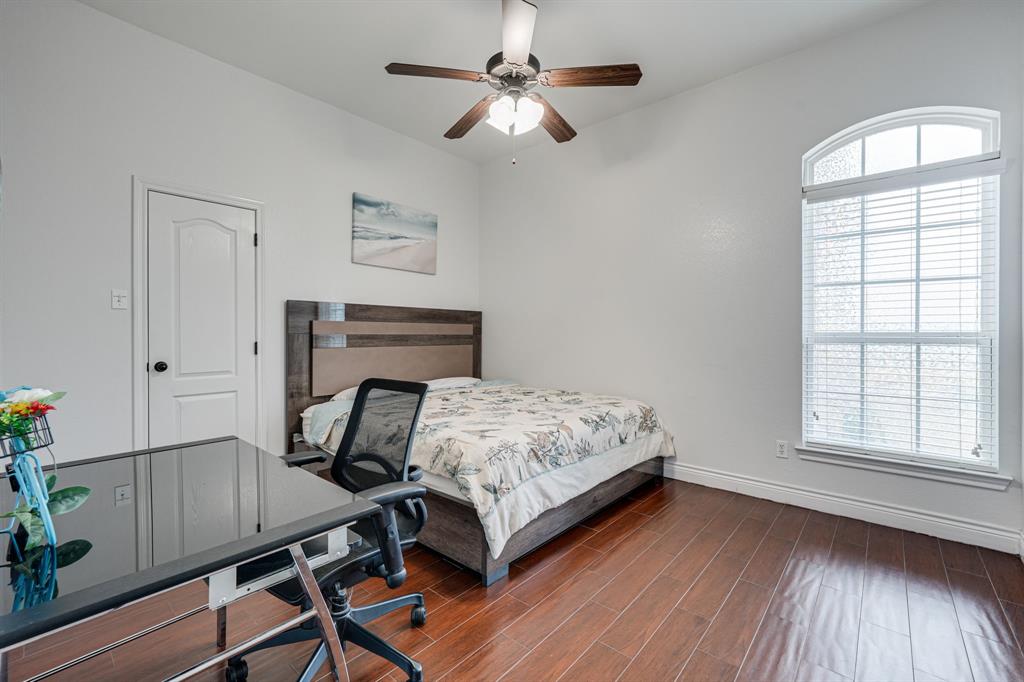 1192 Seaborn Road Ponder, TX 76259 - Photo 21 of 40 a bedroom with bed and a window