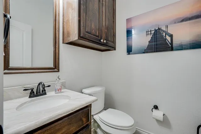a utility room with sink dryer and washer