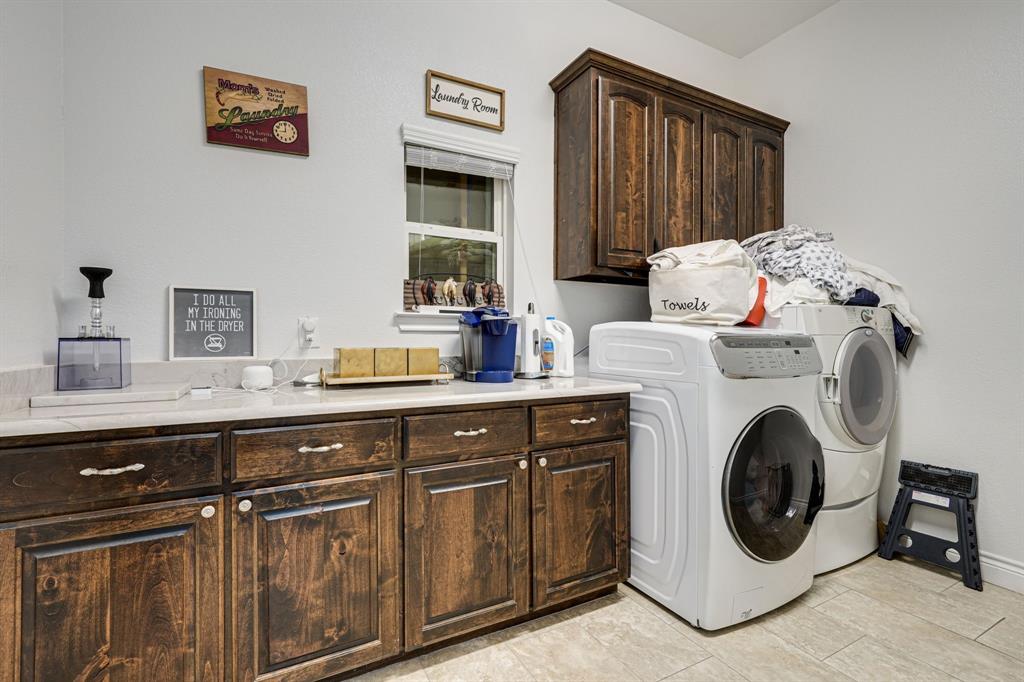 1192 Seaborn Road Ponder, TX 76259 - Photo 29 of 40 a utility room with sink dryer and washer