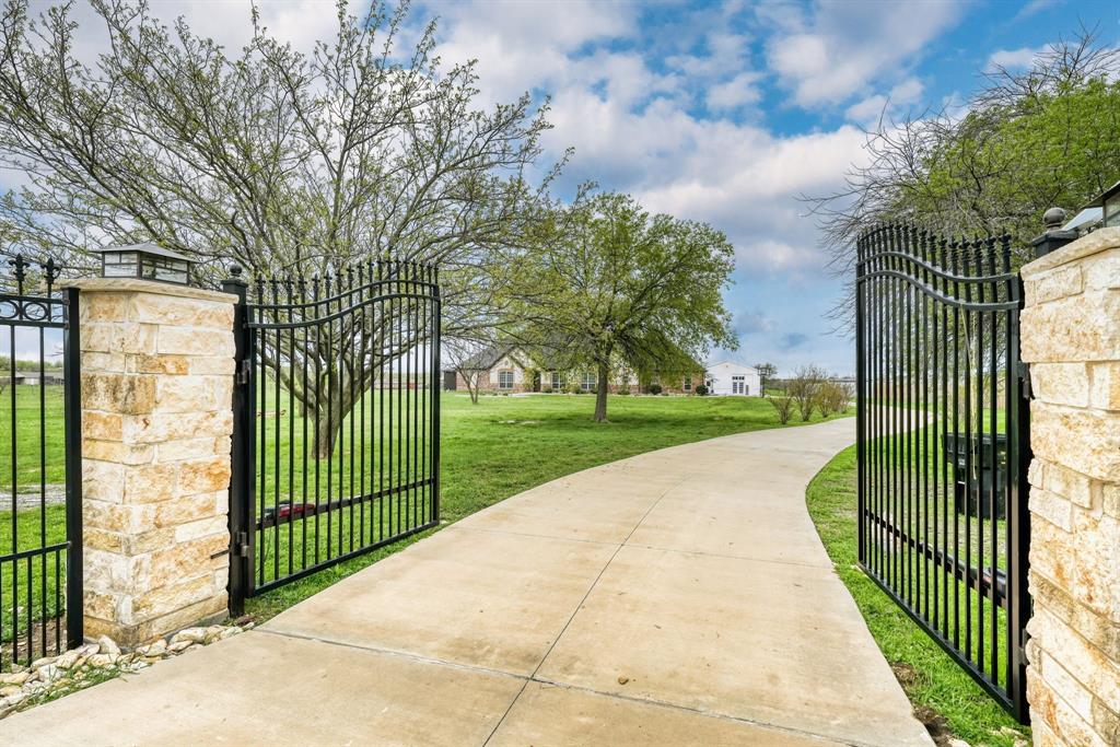 1192 Seaborn Road Ponder, TX 76259 - Photo 3 of 40 a view of a garden and pathway