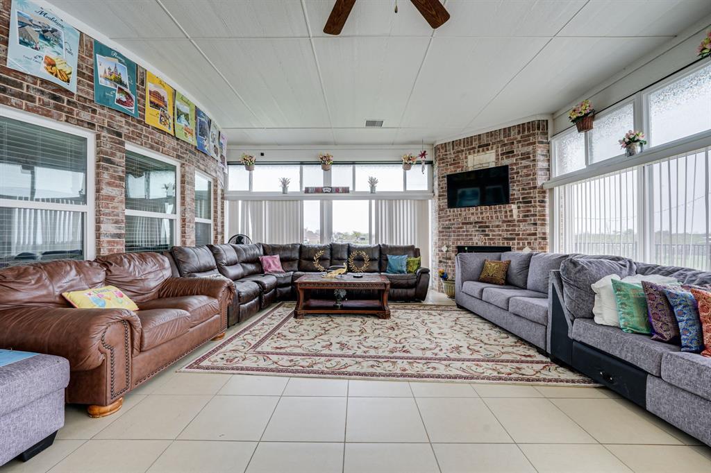 1192 Seaborn Road Ponder, TX 76259 - Photo 31 of 40 a living room with furniture and a flat screen tv