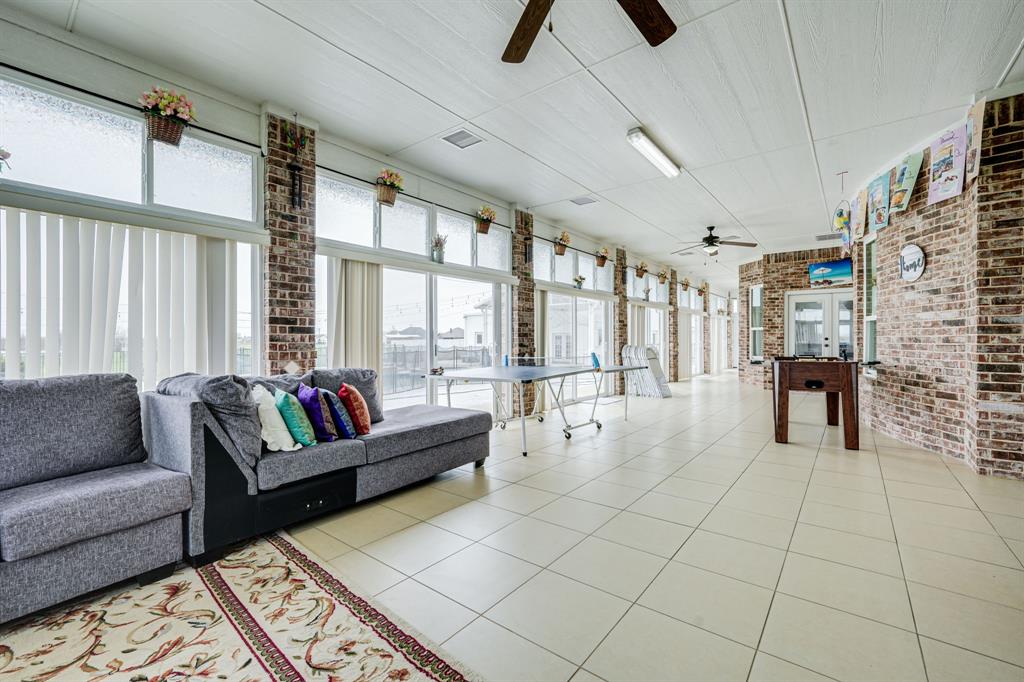 1192 Seaborn Road Ponder, TX 76259 - Photo 32 of 40 a living room with furniture and a large window