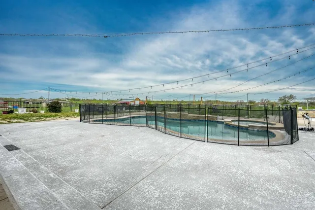 a view of a swimming pool with a patio