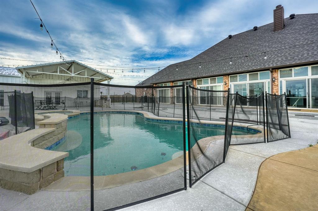 1192 Seaborn Road Ponder, TX 76259 - Photo 34 of 40 a view of a swimming pool with a patio