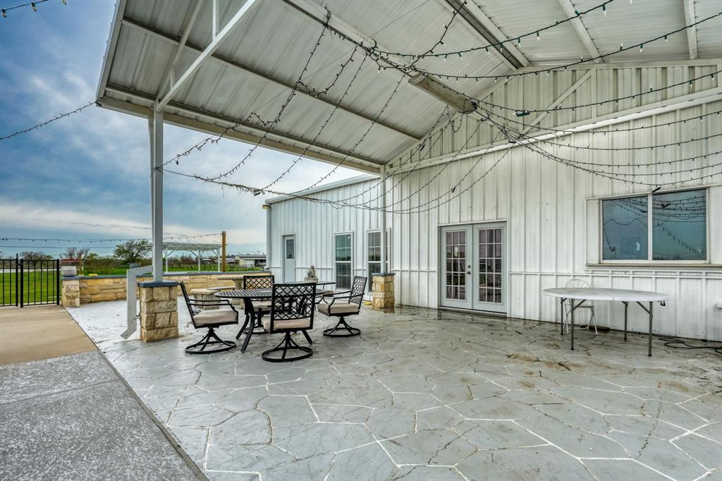 1192 Seaborn Road Ponder, TX 76259 - Photo 35 of 40 a view of a patio with table and chairs
