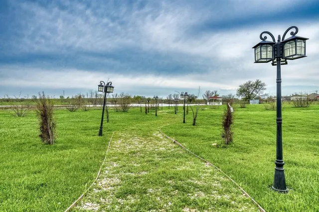 a view of a golf course with a big yard