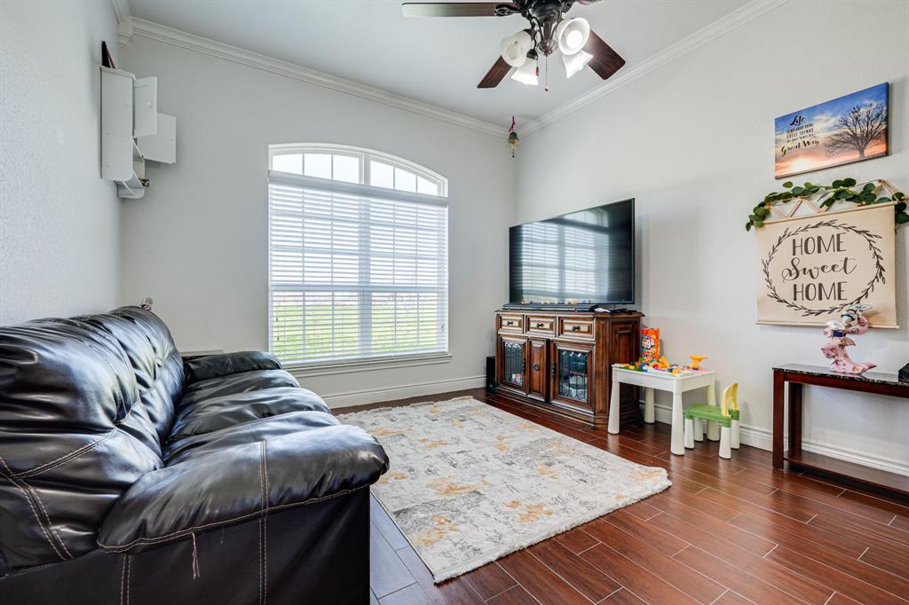 1192 Seaborn Road Ponder, TX 76259 - Photo 7 of 40 a living room with furniture and a flat screen tv