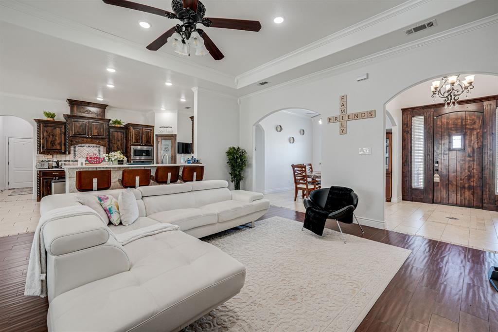 1192 Seaborn Road Ponder, TX 76259 - Photo 10 of 40 a living room with furniture and a chandelier