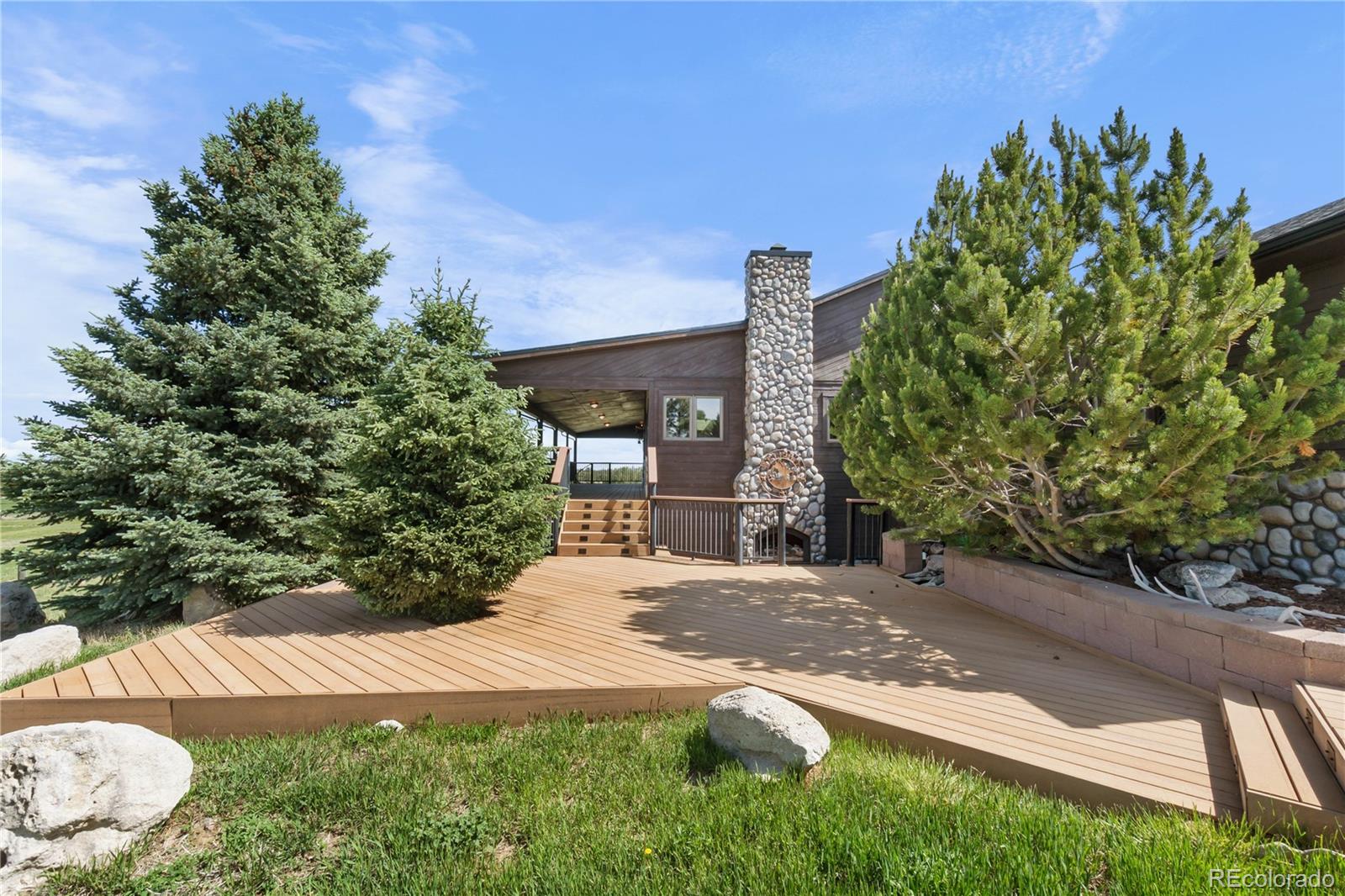 74 Rocky Cliff Road Elizabeth, CO 80107 - Photo 49 of 50 a view of a backyard with a garden