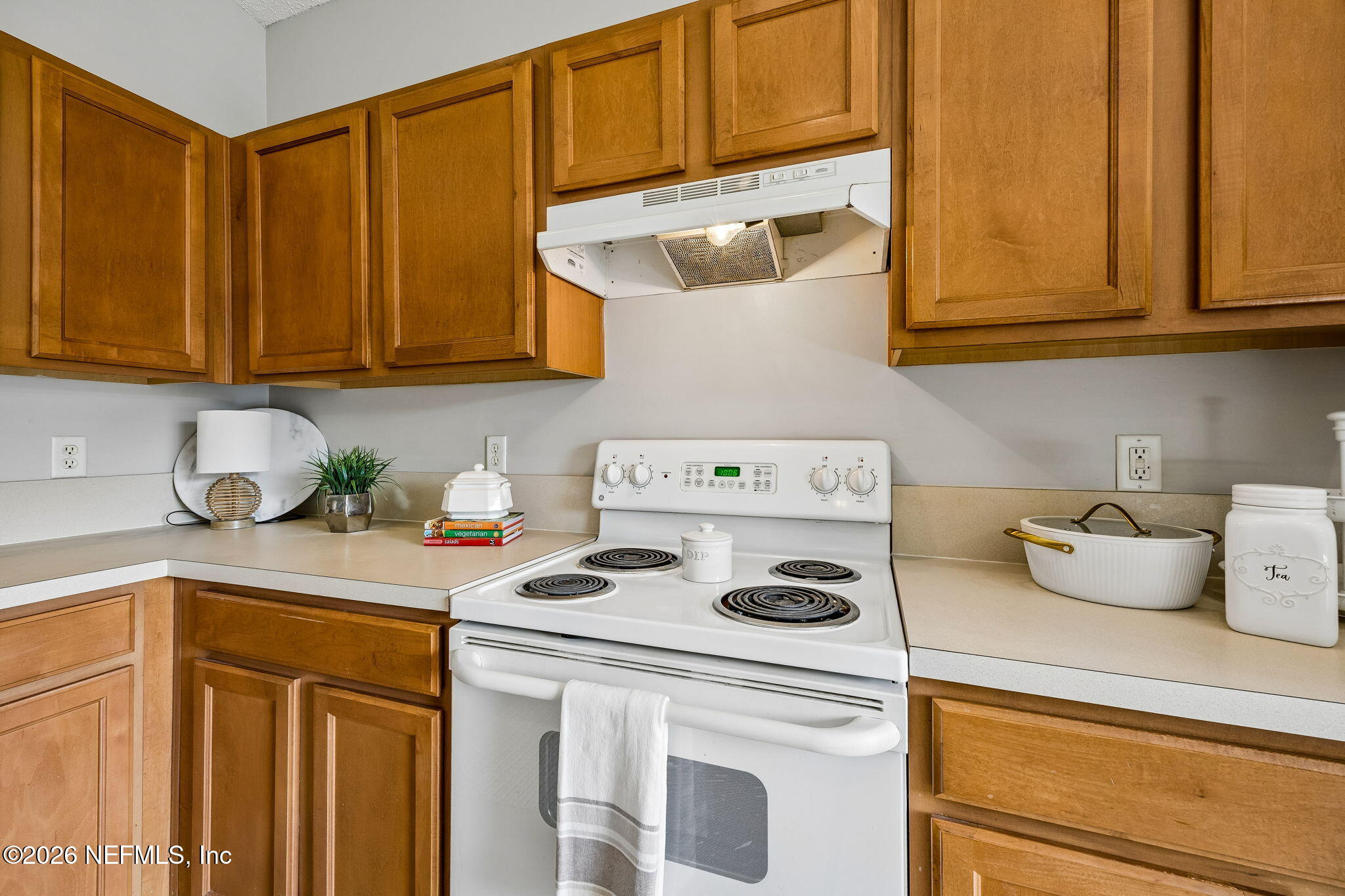 676 Timbermill Lane Orange Park, FL 32065 - Photo 13 of 60 a kitchen with a stove top oven a sink and cabinets