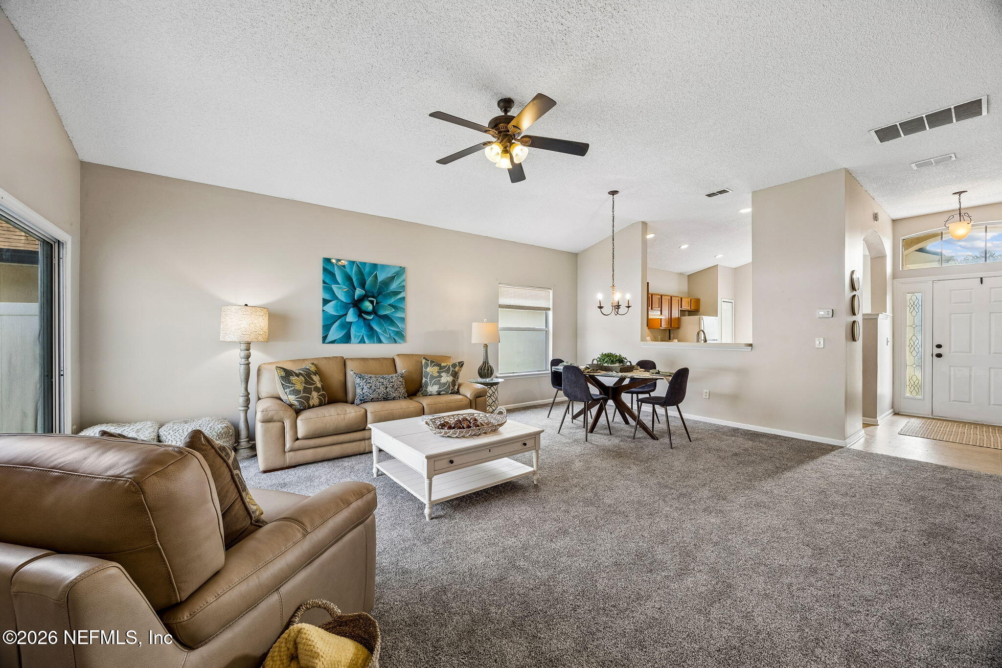 676 Timbermill Lane Orange Park, FL 32065 - Photo 8 of 60 a living room with furniture and a large window