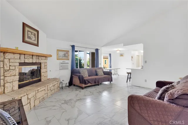 a living room with furniture and large windows