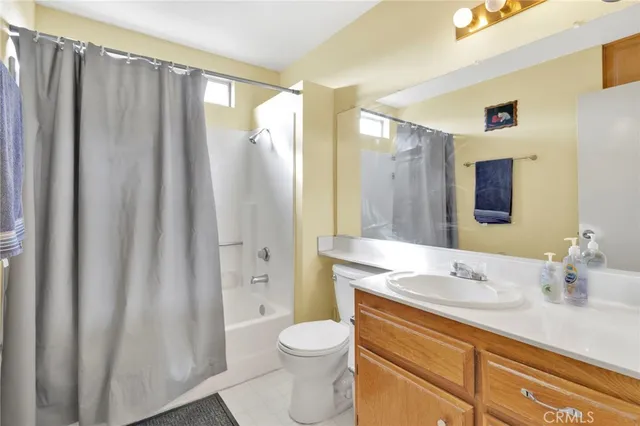 a bedroom with a bed chair and window