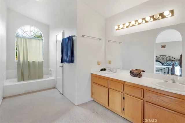 a bathroom with a glass shower door