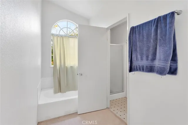 a view of a house with swimming pool and sitting area