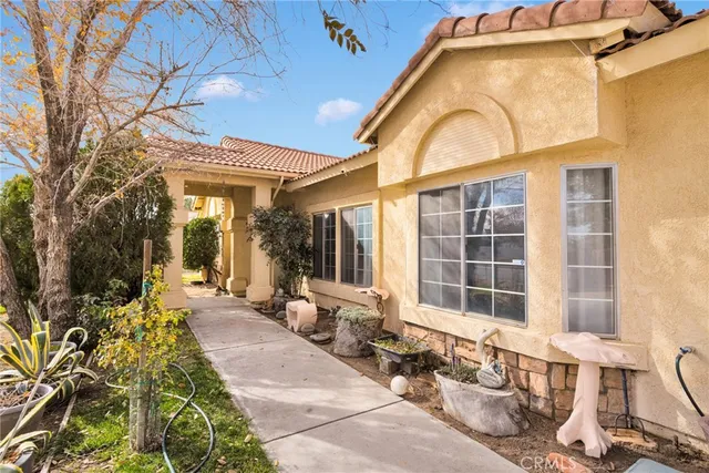 a view of a bathroom with a shower and a mirror