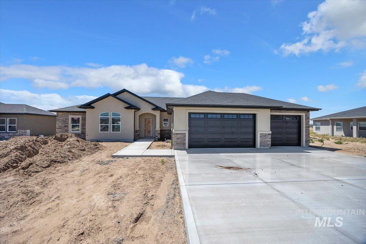 1205 Moss Rupert, ID 83350 - Photo 1 of 3 Contemporary single-story residence with a stucco and stone veneer facade