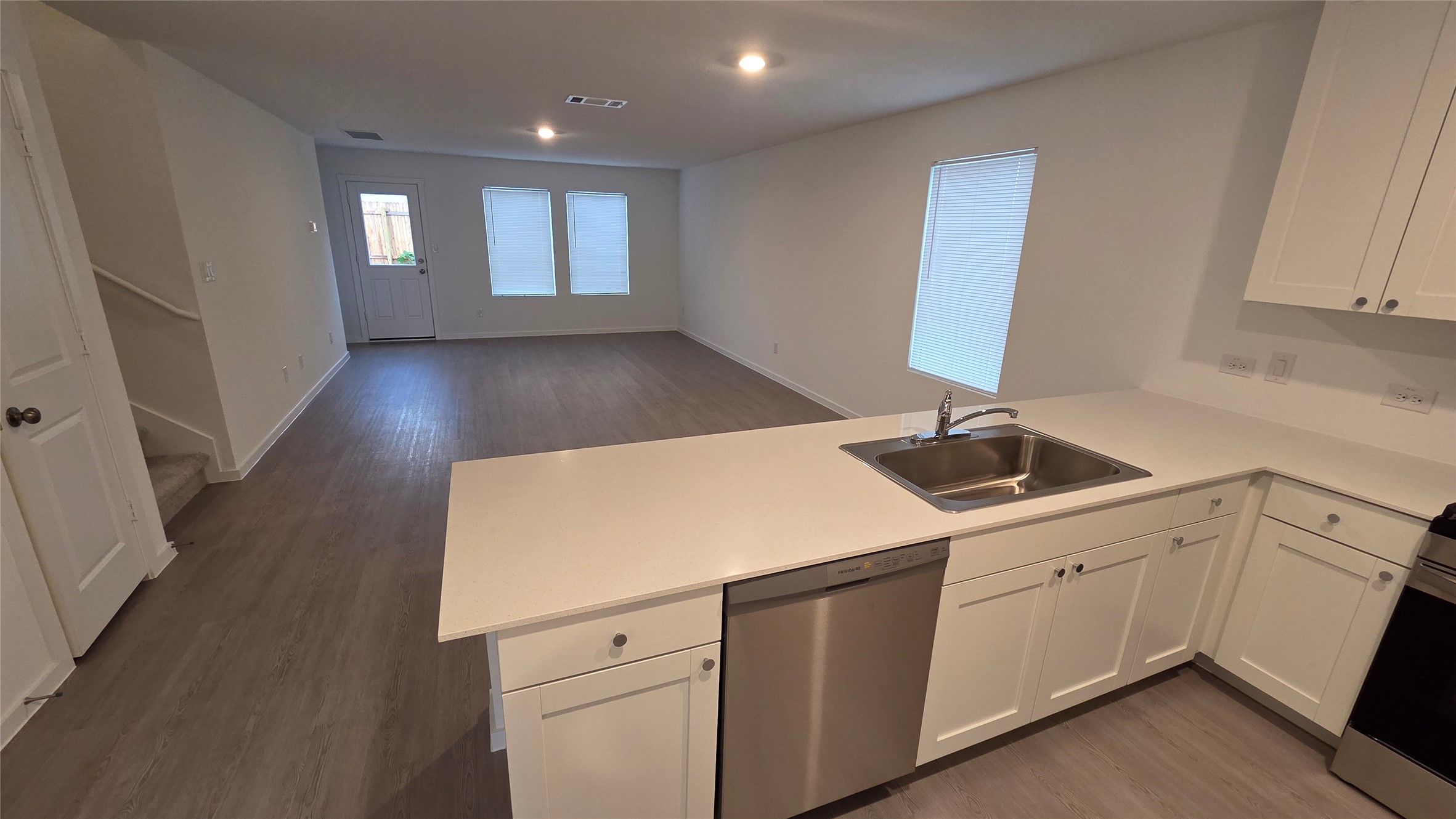 110 Canadian Cove Kyle, TX 78640 - Photo 4 of 20 a kitchen with a sink cabinets and wooden floor