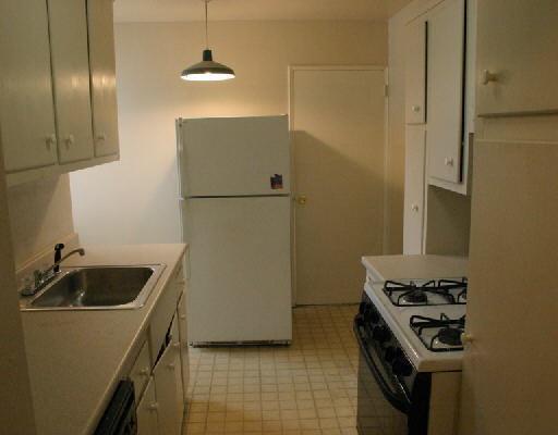 a kitchen with a sink and a stove