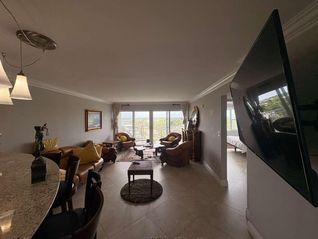 2611 North Riverside Drive, Unit 703 Pompano Beach, FL 33062 - Photo 50 of 81 a living room with furniture window and wooden floor