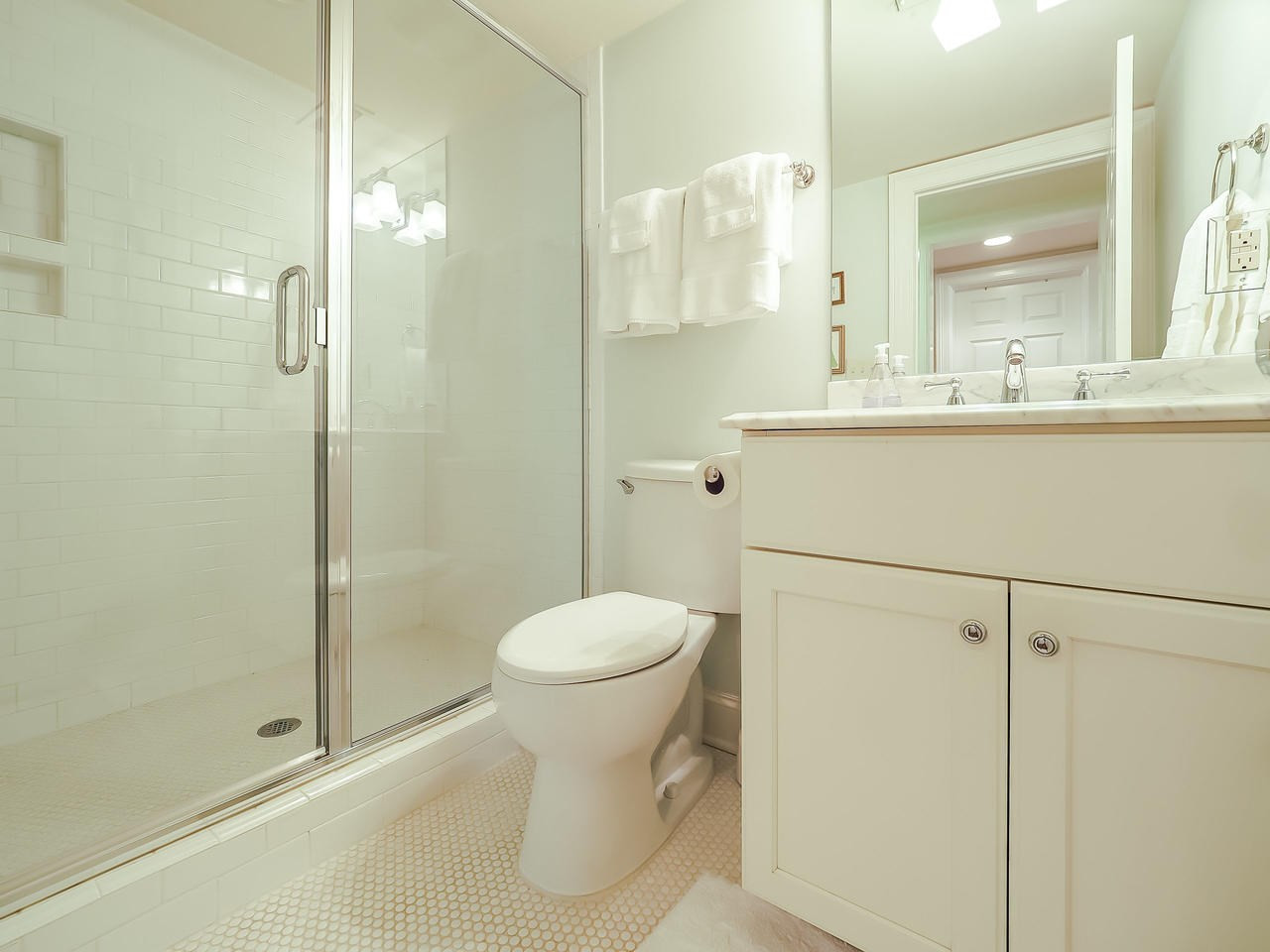 1415 10th Avenue Raleigh, NC 27607 - Photo 12 of 21 a bathroom with a sink toilet and shower