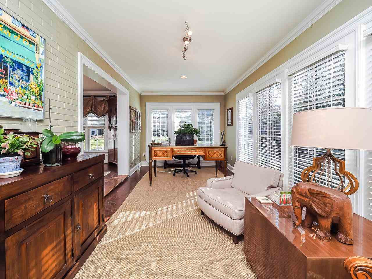 1415 10th Avenue Raleigh, NC 27607 - Photo 5 of 21 a living room with furniture and a large window