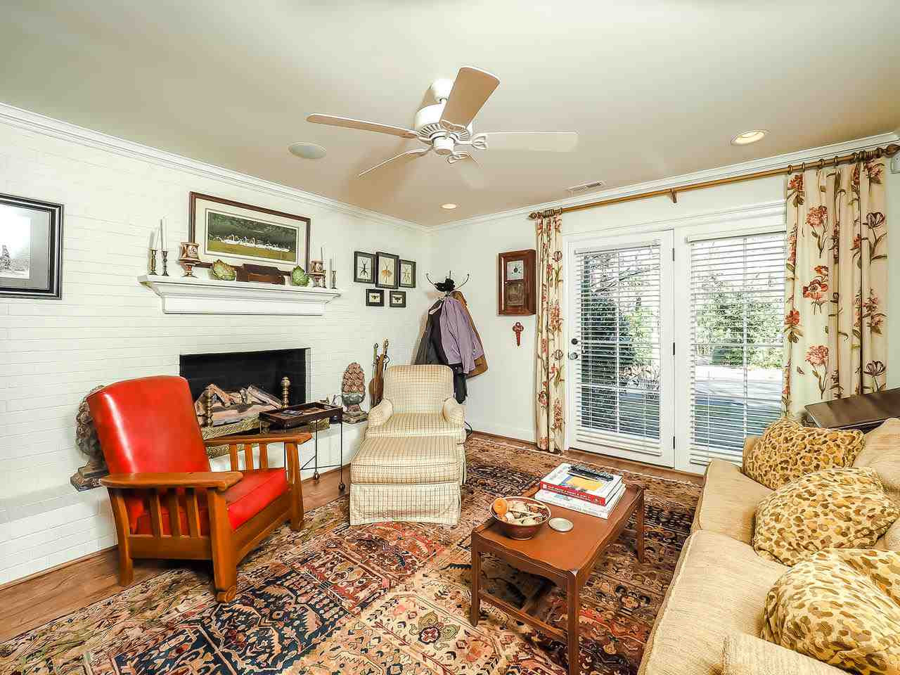 1415 10th Avenue Raleigh, NC 27607 - Photo 10 of 21 a living room with furniture and a fireplace
