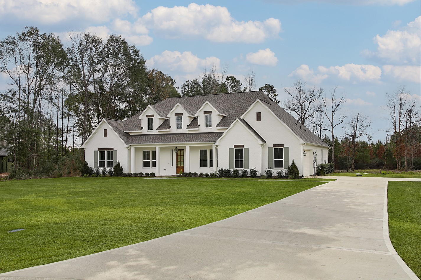 11842 Grand N Road Willis, TX 77378 - Photo 2 of 38 Spacious, traditional home with classic exterior features set back from the road for privacy.