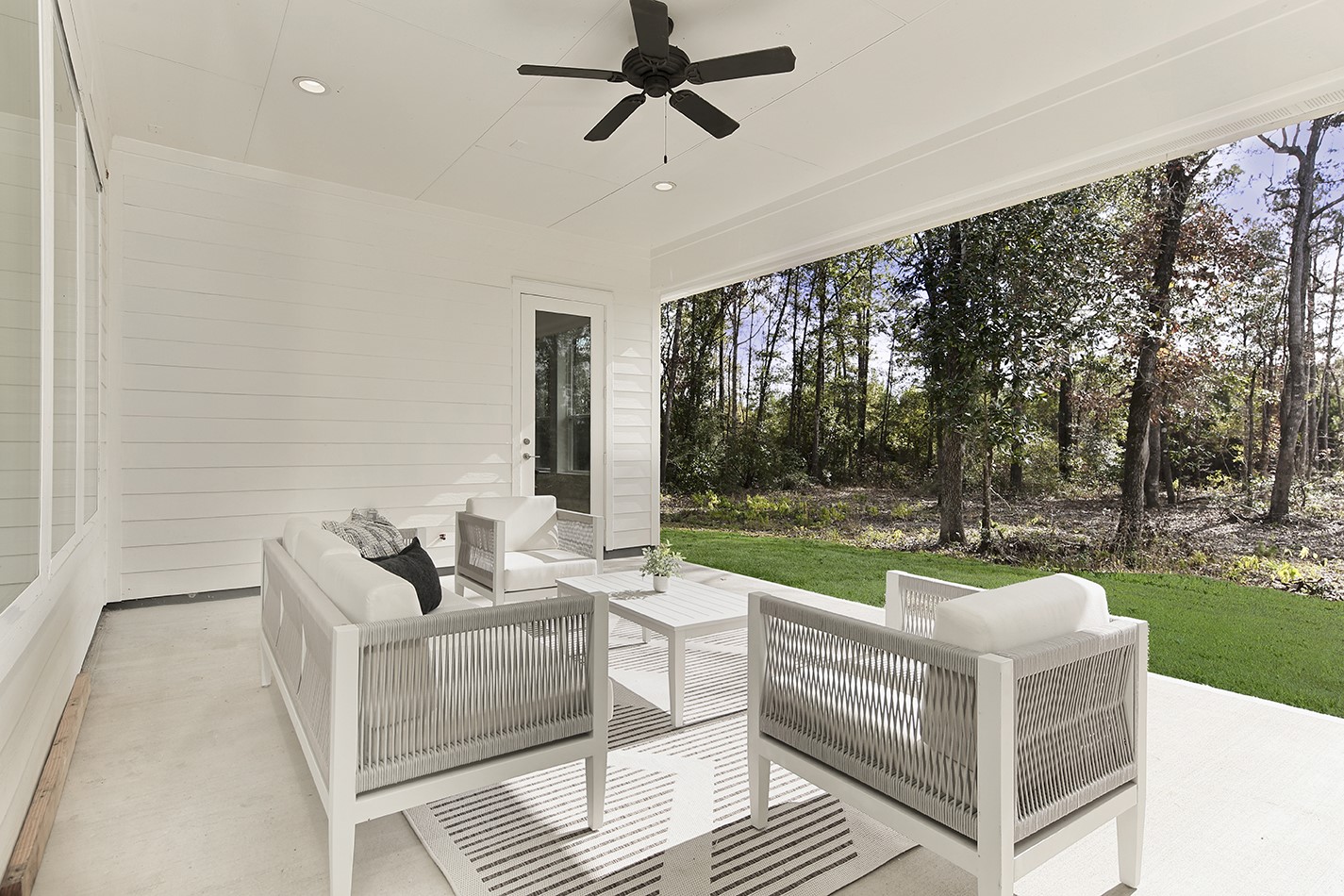 11842 Grand N Road Willis, TX 77378 - Photo 29 of 38 Beautiful covered patio has room to enjoy outdoor living in private setting ideal for relaxation and entertaining.