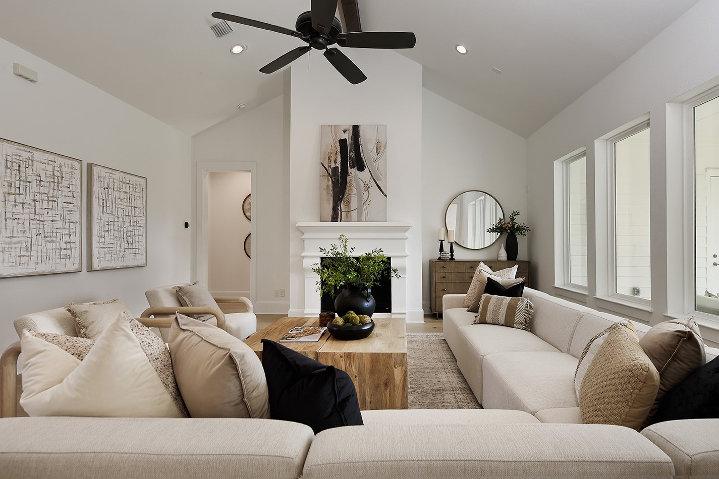 11842 Grand N Road Willis, TX 77378 - Photo 9 of 38 Sensational living room will appeal to all of your senses with cathedral ceilings, elegant fireplace, plate glass windows and a gorgeous, inviting neutral color palette.