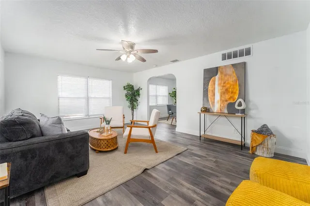 a living room with furniture and a window