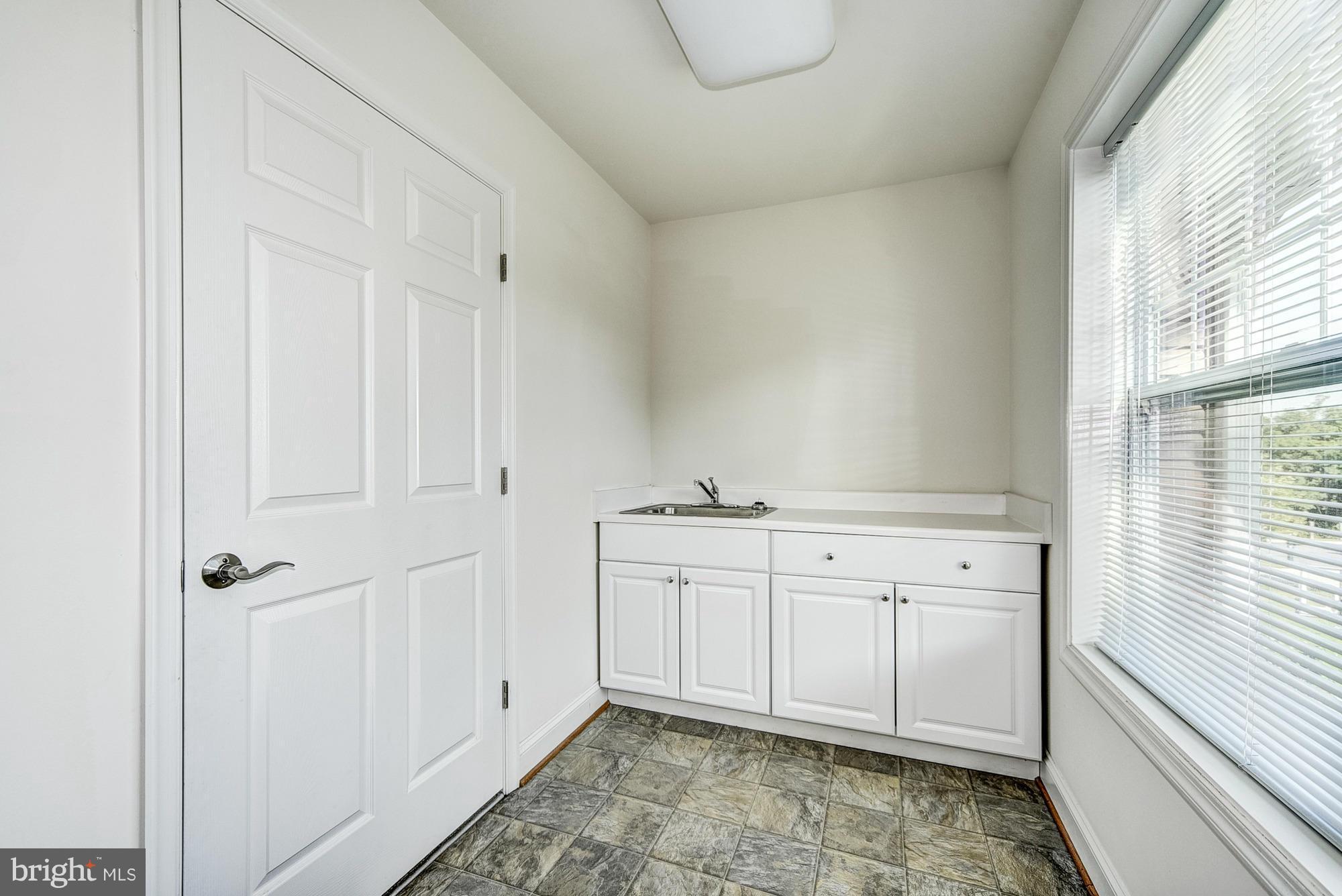 1905 Kermit Road Silver Spring, MD 20910 - Photo 17 of 24 a view of a kitchen with white cabinets