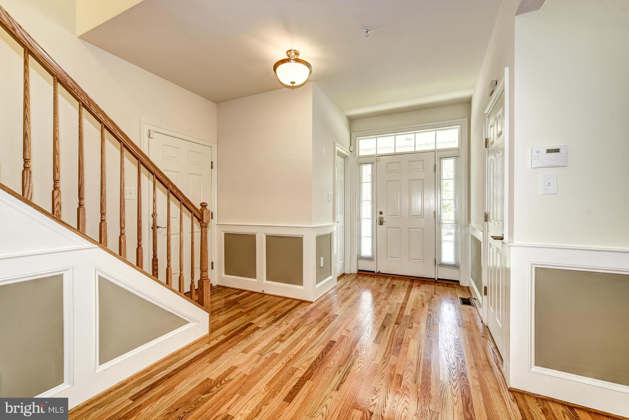 1905 Kermit Road Silver Spring, MD 20910 - Photo 3 of 24 a view of a hallway with wooden floor and staircase