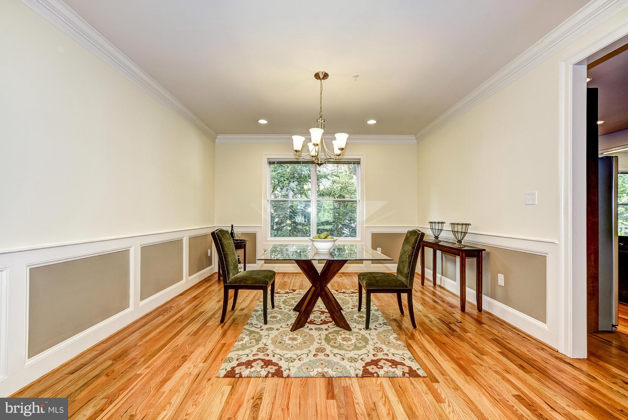 1905 Kermit Road Silver Spring, MD 20910 - Photo 8 of 24 a dining room with furniture a rug and wooden floor