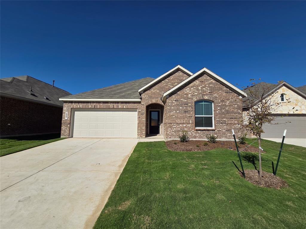 925 Calley Pear Trail Princeton, TX 75407 - Photo 1 of 24 a front view of a house with a garden and yard