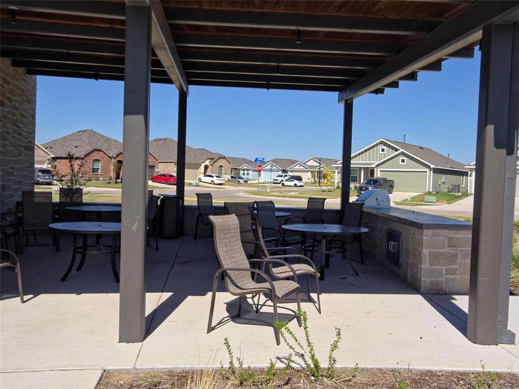 925 Calley Pear Trail Princeton, TX 75407 - Photo 20 of 24 a view of a chairs and table in the patio