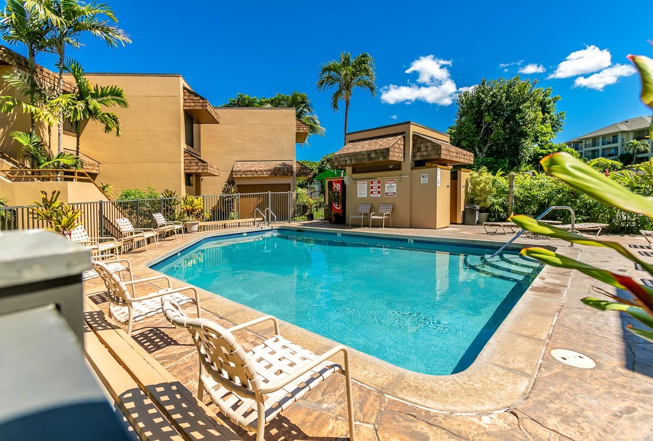 2381 South Kihei Road, Unit B107 Kihei, HI 96753 - Photo 18 of 29 a view of a swimming pool with a lounge chairs