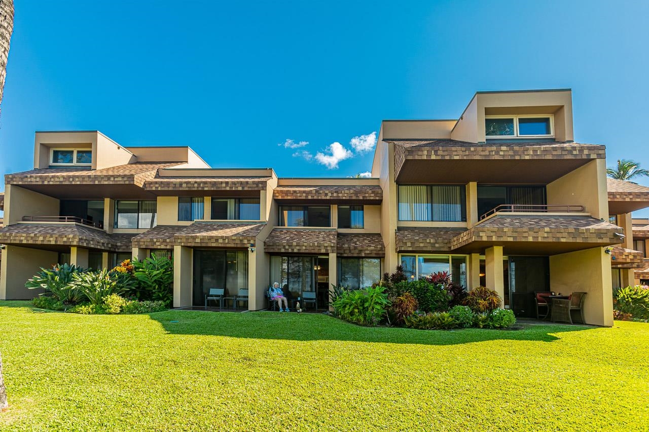 2381 South Kihei Road, Unit B107 Kihei, HI 96753 - Photo 22 of 29 a front view of a building with garden